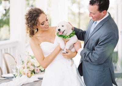 couple with puppy